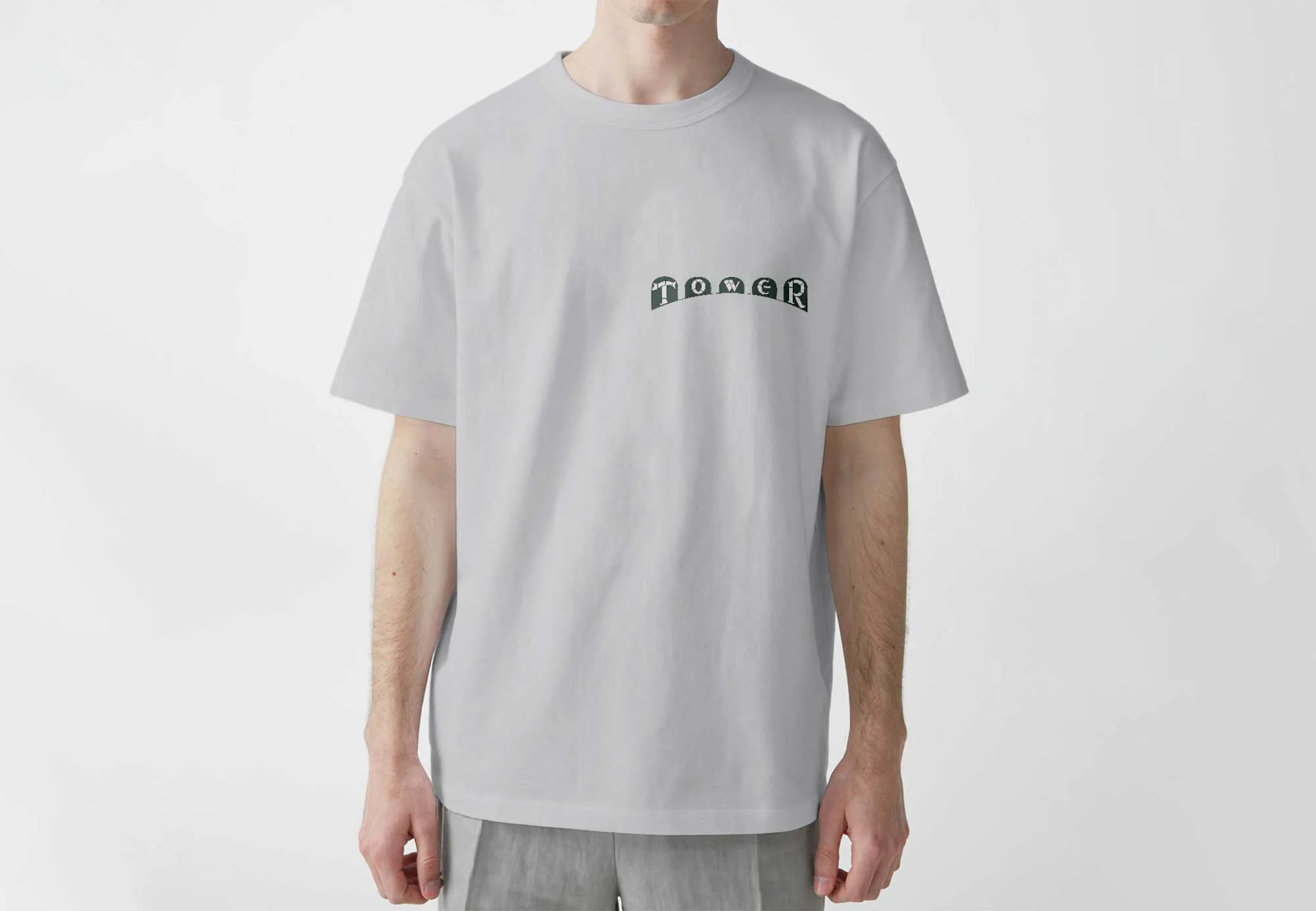 'Ulltmate Tower print t-shirt with the sage green and cream Tower Cinema facade