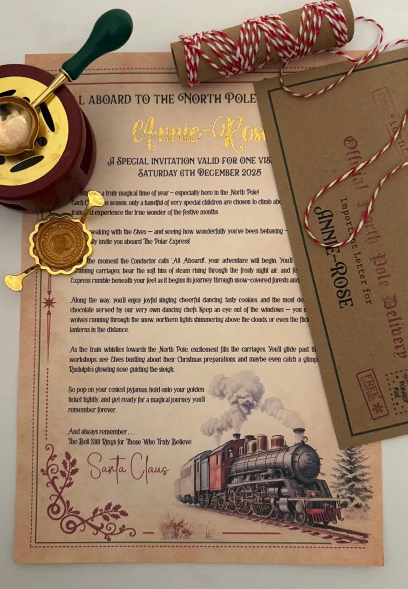 Magical Polar Express invitation letter on coffee stained card with a child's name in gold foil