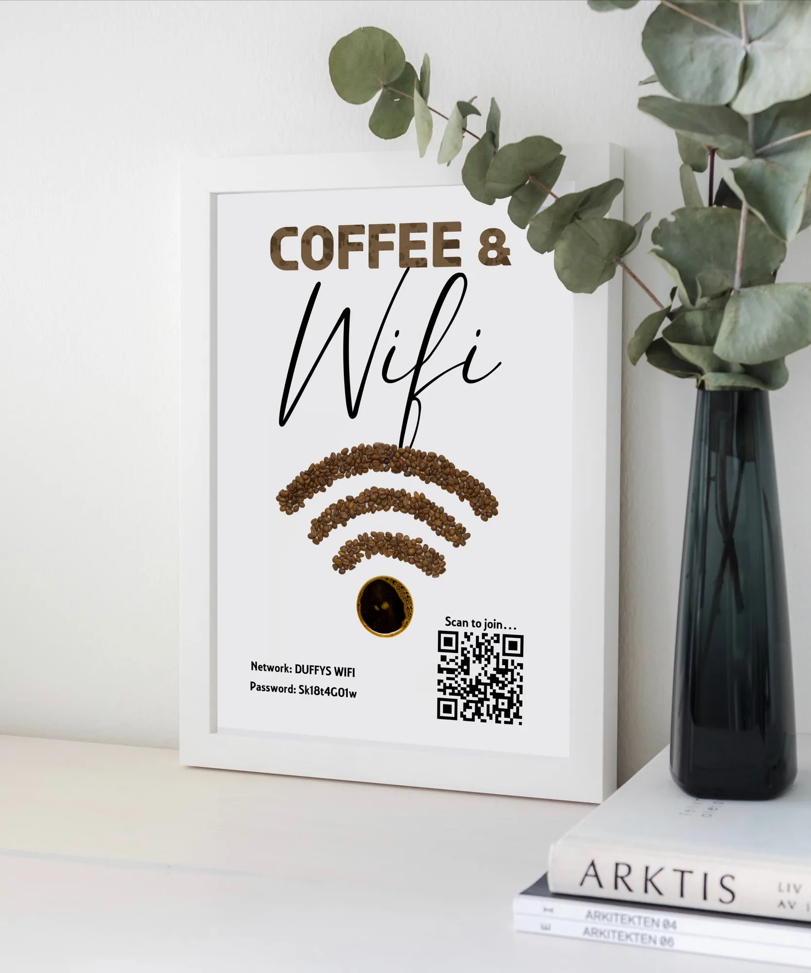 Personalised coffee and WiFi print with a scannable code, framed in a kitchen