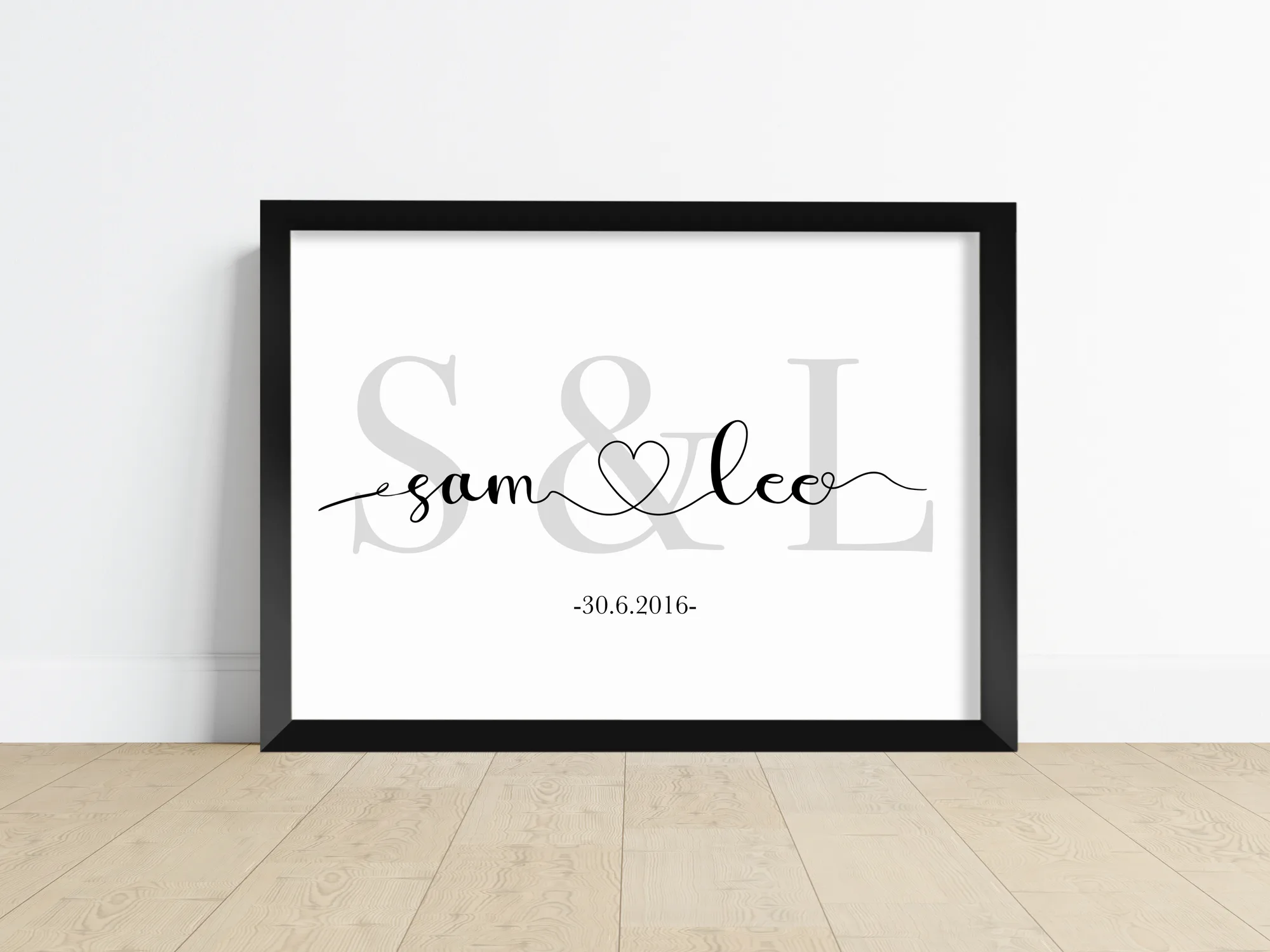 A personalised name and initial print with a couple's names, initials and a meaningful date