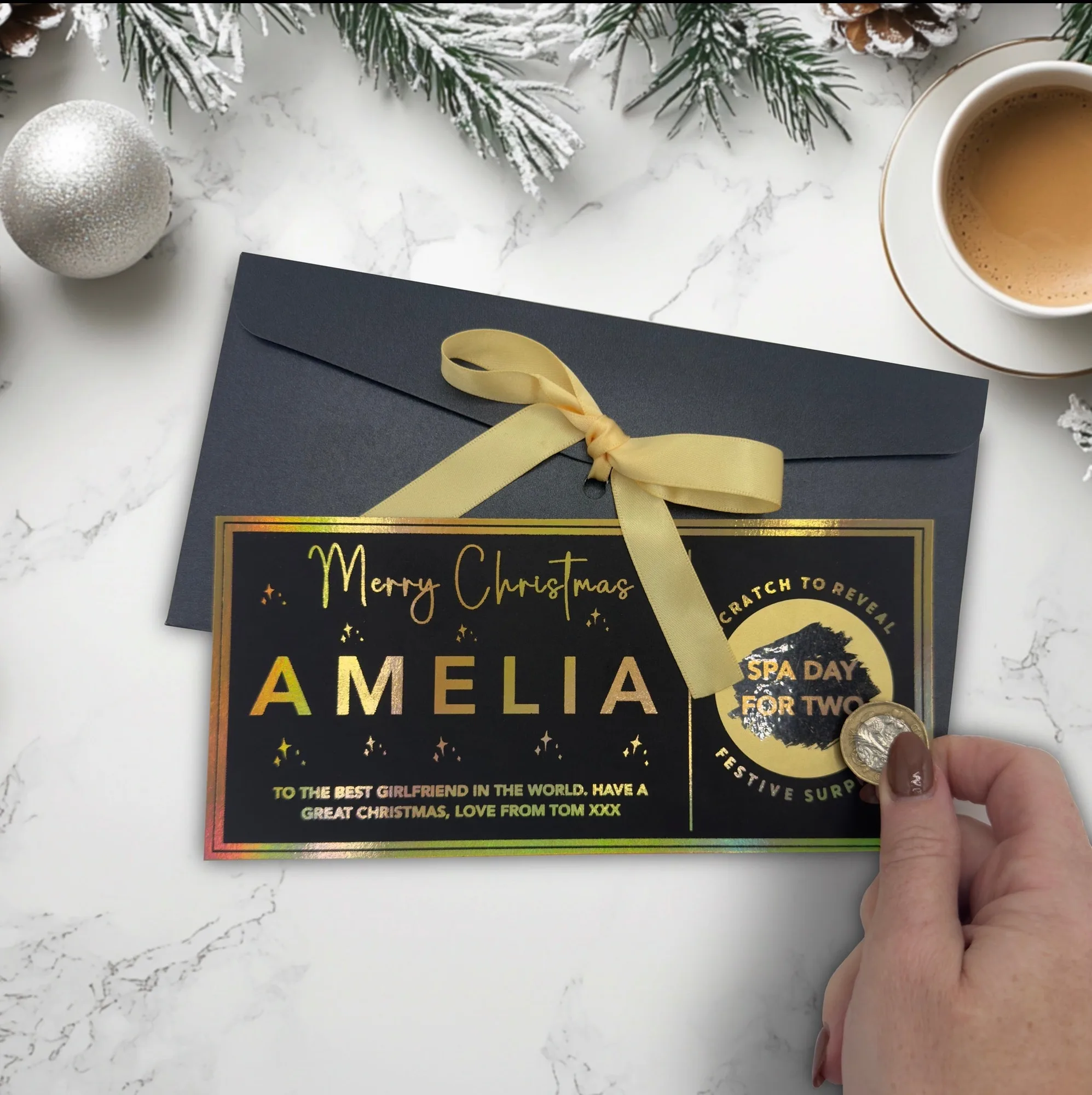 Personalised Christmas scratch reveal ticket with a foiled panel and a name